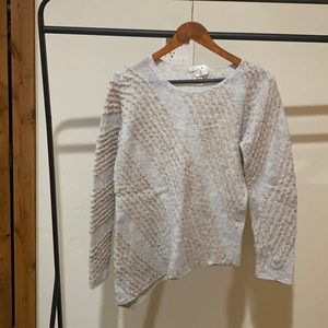 Angled waist sweater